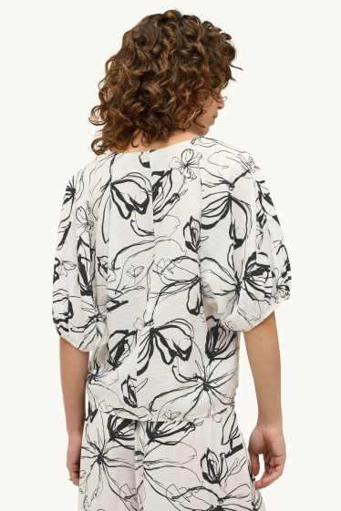 Dames - Blouse met V-hals - gebloemd - wit / zwart