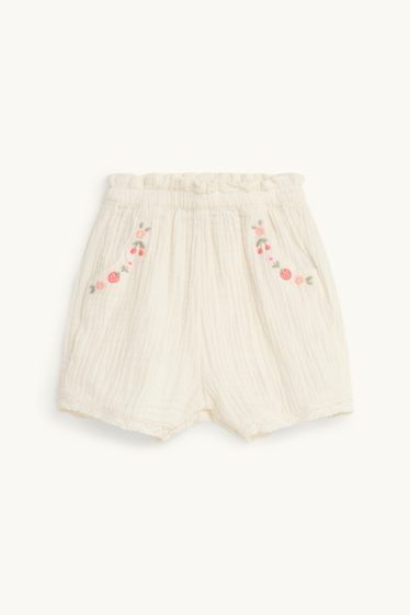 Baby: meisjes - Bloemetjes - mousseline babyshort - crèmekleurig