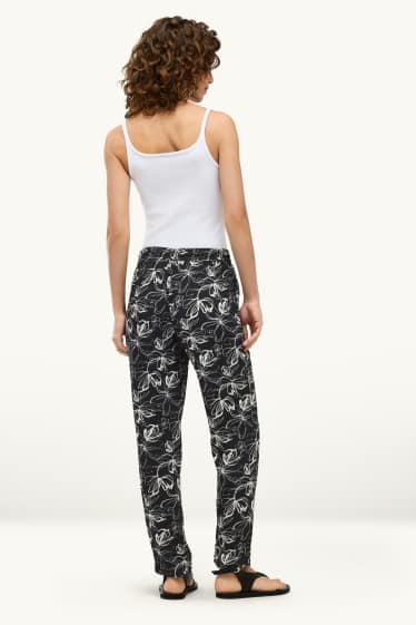 Donna - Pantaloni - vita media - tapered fit - a fiori - bianco / nero