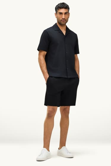 Uomo - Shorts di felpa - tessuto tramato - nero