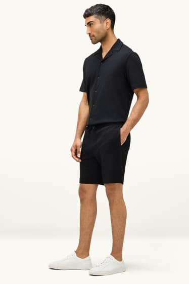 Uomo - Shorts di felpa - tessuto tramato - nero