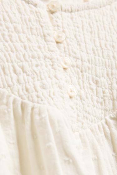 Kinderen: meisjes - Blouse van mousseline - gesmokt - crème wit