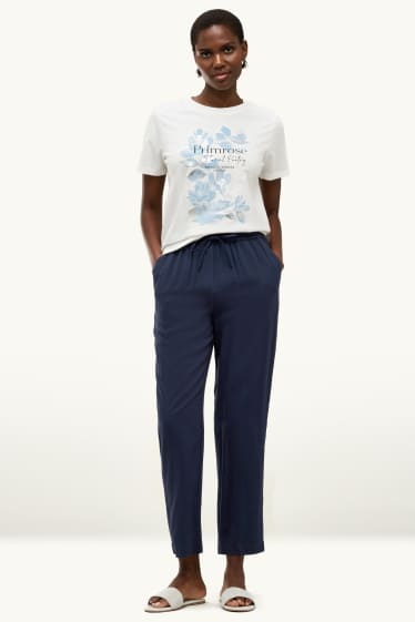 Dona - Pantalons de tela - mid waist - tapered fit - blau fosc