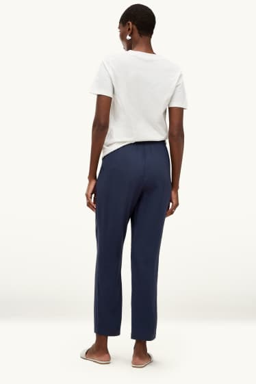 Dona - Pantalons de tela - mid waist - tapered fit - blau fosc