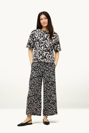 Femmes - Pantalon en toile court - mid waist - wide leg - à motif - noir / beige