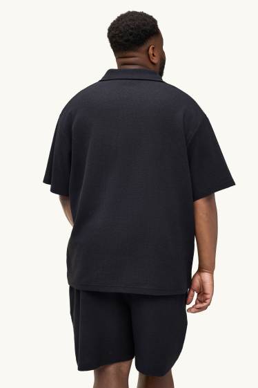 Uomo - Polo - relaxed fit - tessuto tramato - nero