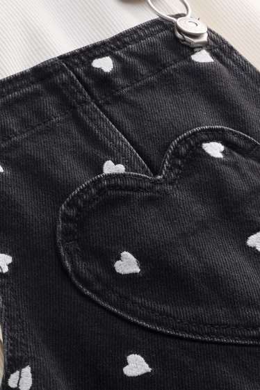 Kinderen: meisjes - Hartje - set - longsleeve en denim overgooier - 2 delig - wit / zwart