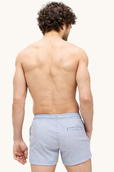 Hommes - Short de bain - finition texturée - bleu / blanc
