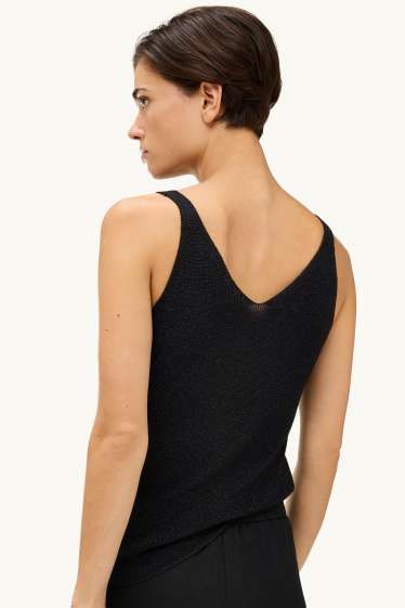 Dona - Top - efecte brillant - negre/platejat