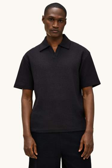 Heren - Gebreid poloshirt - relaxed fit - zwart