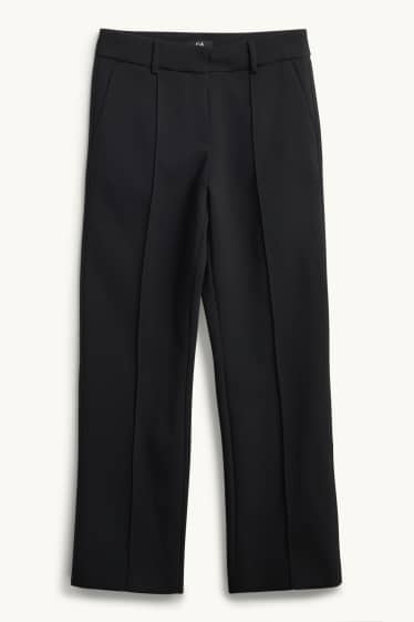 Dona - Pantalons de tela - mid waist - acampanats - negre