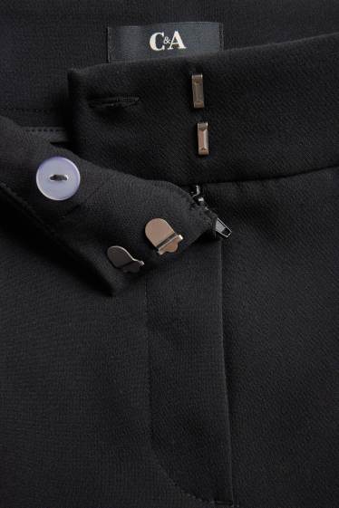 Dona - Pantalons de tela - mid waist - acampanats - negre