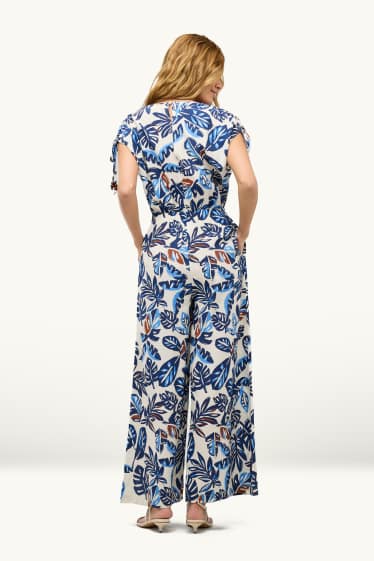 Femmes - Combinaison avec encolure en V et perles - à motif - bleu / blanc
