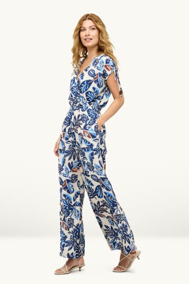 Femmes - Combinaison avec encolure en V et perles - à motif - bleu / blanc