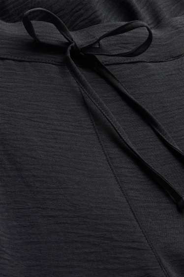 Women - Harem trousers - mid-rise waist - balloon leg - black