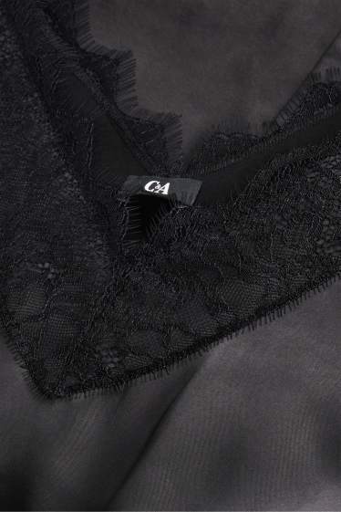 Femmes - Caraco en satin - noir