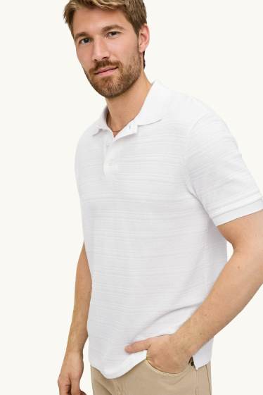 Home - Polo de punt de mitja - regular fit - texturat - de ratlles - blanc