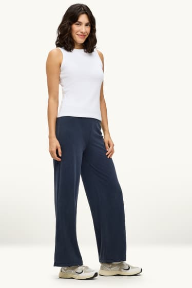 Dona - Pantalons de tela - mid waist - palazzo - blau fosc
