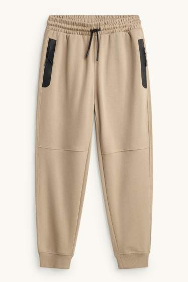 Kinder Buben - Jogginghose - schwarz / beige