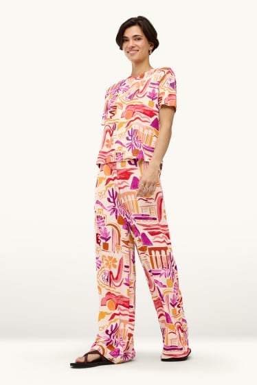Dames - Pantalon - mid waist - palazzo - met patroon - oranje