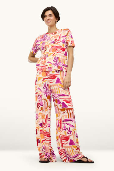 Dames - Pantalon - mid waist - palazzo - met patroon - oranje
