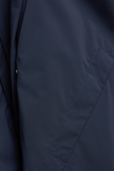 Dona - Jaqueta tècnica amb caputxa - folrada - impermeable - blau fosc