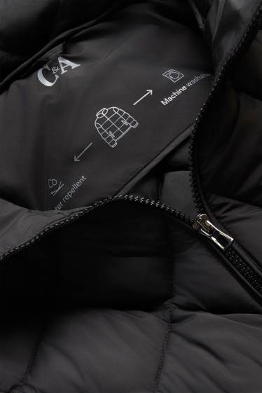 Femei - Vestă matlasată cu glugă - rezistentă la apă - negru