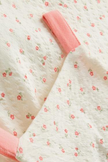 Baby: meisjes - Bloemetje - babyjurk - met structuur - wit