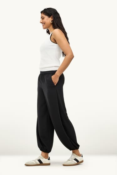Dames - Harembroek - mid waist - balloon fit - zwart