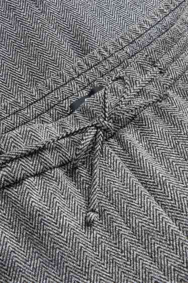 Dámské - Žerzejové kalhoty - mid waist - tapered fit - se vzorem - šedá-žíhaná