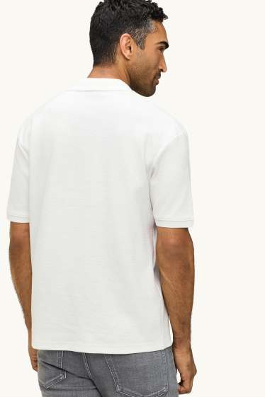 Uomo - Polo - relaxed fit - tessuto tramato - bianco