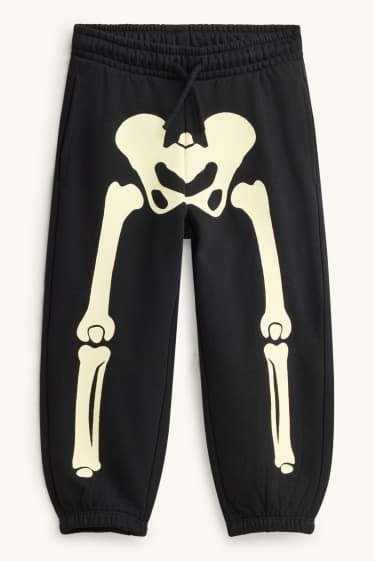 Nen - Halloween - esquelet - pantalons de xandall - brilla en la foscor - negre