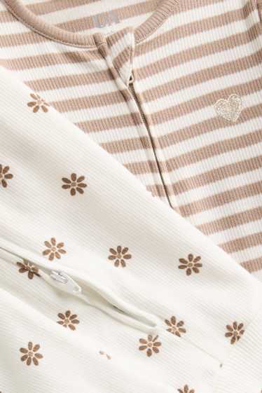 Baby: meisjes - Set van 2 - bloemetjes - babypyjama - geribd - crèmekleurig