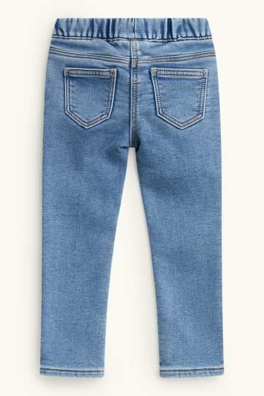 Kinderen: meisjes - Vlinder - jegging jeans - thermojegging - glanseffect - jeanslichtblauw