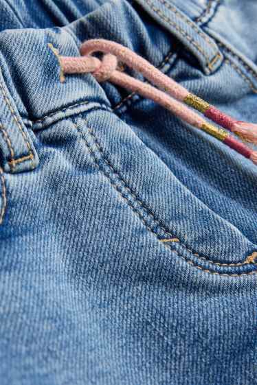 Kinderen: meisjes - Vlinder - jegging jeans - thermojegging - glanseffect - jeanslichtblauw