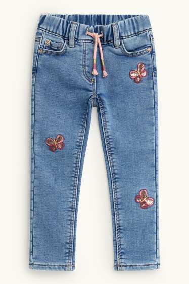 Kinderen: meisjes - Vlinder - jegging jeans - thermojegging - glanseffect - jeanslichtblauw