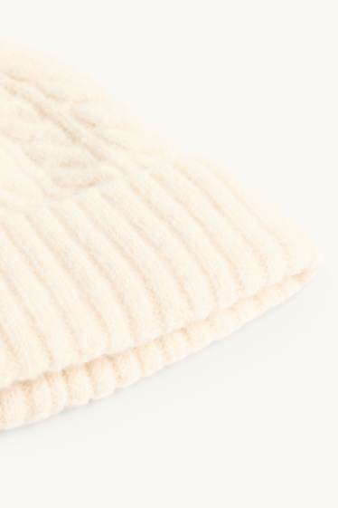 Kinderen: meisjes - Muts met pompon - kabelpatroon - crèmekleurig