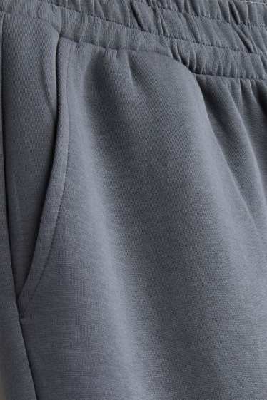 Uomo - Pantaloni sportivi - grigio