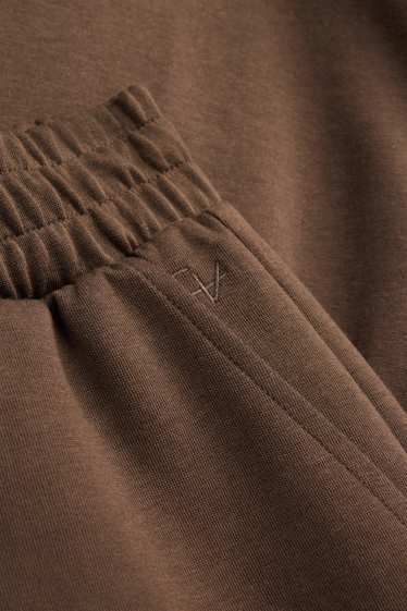 Uomo - Pantaloni sportivi - marrone scuro