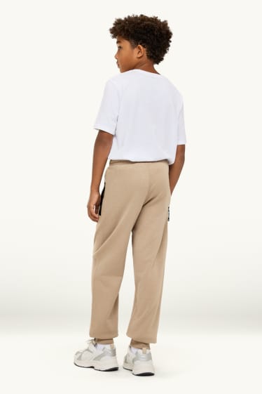 Kinder Buben - Jogginghose - schwarz / beige
