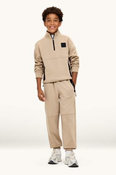 Kinder Buben - Jogginghose - schwarz / beige