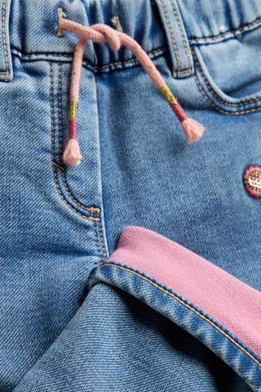Kinderen: meisjes - Vlinder - jegging jeans - thermojegging - glanseffect - jeanslichtblauw