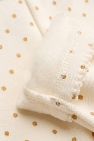 Baby: meisjes - Babylegging - gevoerd met pluche - gestippeld - crèmekleurig