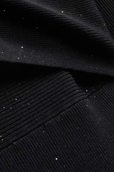 Dames - Wikkeljurk - geribd - glanseffect - zwart