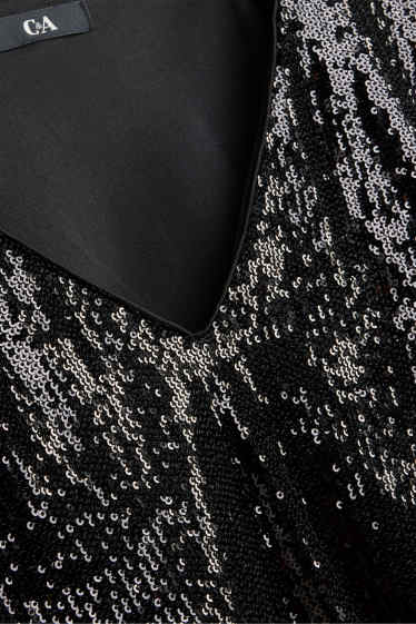Dames - Blouse met pailletten en V-hals - zwart / zilver