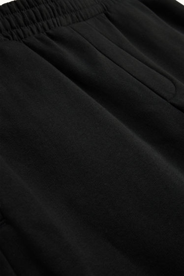 Uomo - Pantaloni sportivi - nero