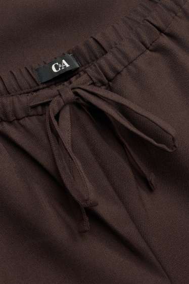 Dona - Pantalons de tela - mid waist - wide leg - marró fosc