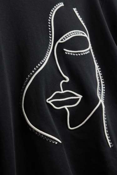 Damen - Langarmshirt mit Strasssteinen - Regular Fit - schwarz