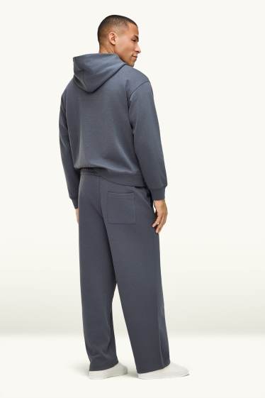 Uomo - Pantaloni sportivi - grigio