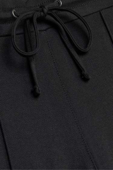 Dona - Pantalons de punt - mid waist - wide leg - negre